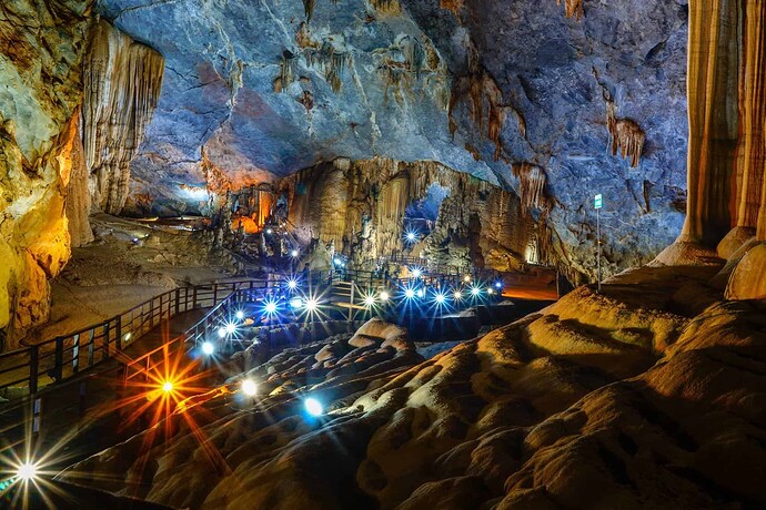 paradise cave lit up with artificial lighting. more pretty than phong nha cave but more walking too